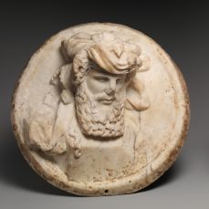 Disque en marbre de Dionysos en relief